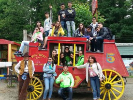 Participants pose with Wild West City’s “Calamity Jane” during a private tour of the park.