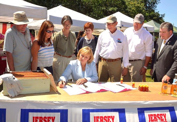 Acting Governor Kim Guadagno was joined, from left, by Robert M. Goodman, Executive Dean of Agriculture and Natural Resources at Rutgers; Marilou Halverson, New Jersey Restaurant Association; Janet Katz, President of the NJ Beekeepers Association; Lina Llona, Middlesex County Chamber of Commerce; Lt. Gov. Kim Guadagno; Douglas H. Fisher, NJ Secretary of Agriculture; Ryck Suydam, New Jersey Farm Bureau and NJ Senator Steven V. Oroho (R-Morris, Sussex, Warren).