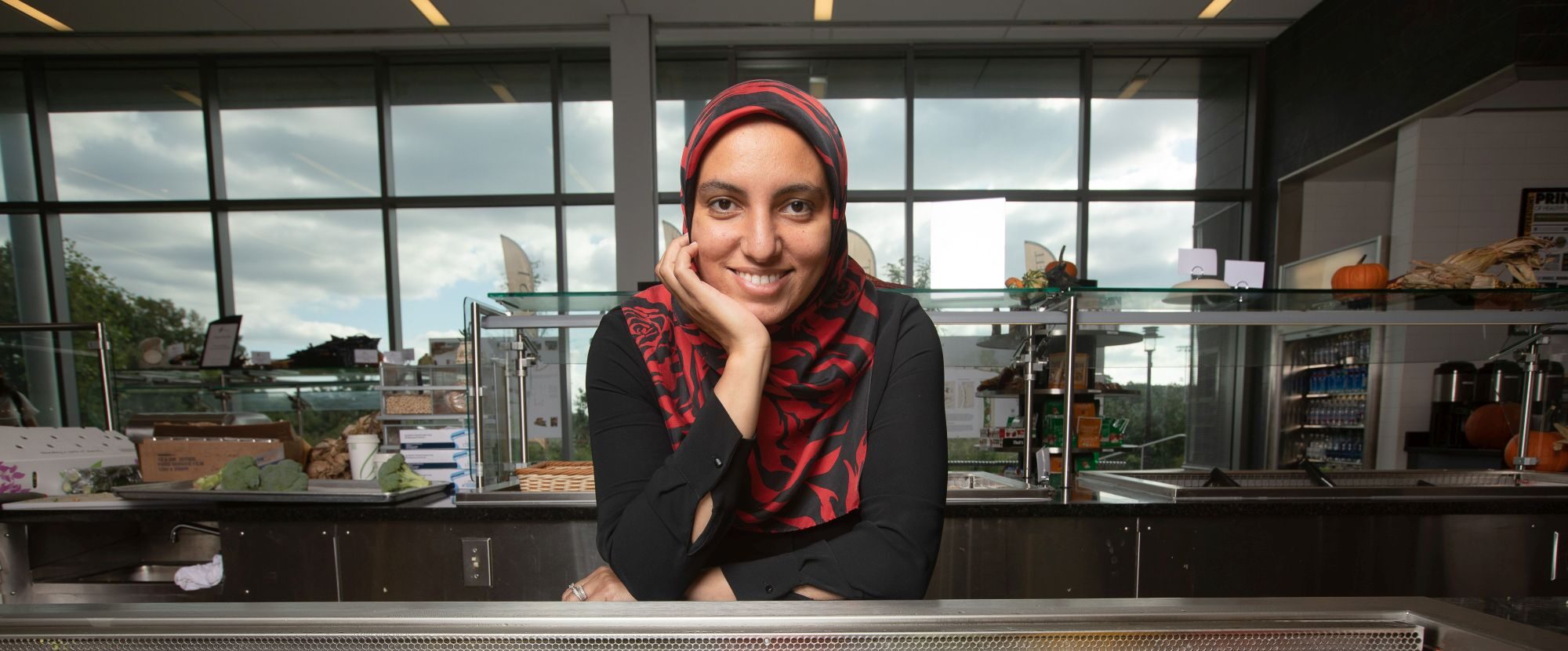 An individual poses for a photograph