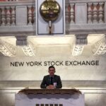 Luis Gasca behind NYSE podium