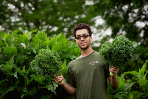 Student holding kale