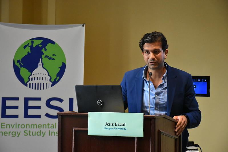 A person standing behind a lectern.