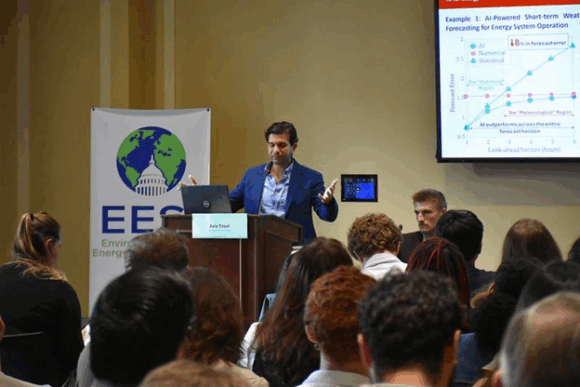 A person addressing a roomful of people