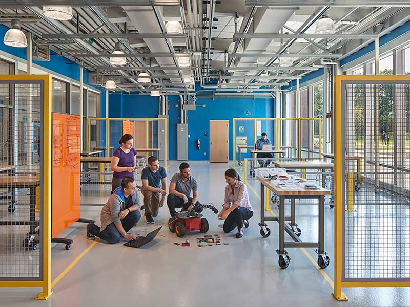 Students working together in an open-concept classroom at the Rutgers School of Engineering