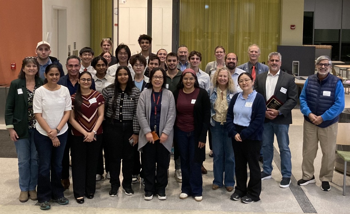 A group of people pose for a picture