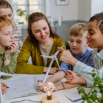 Four young children and a supervising adult engaged in an interactive activity