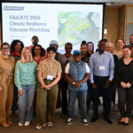 Three rows of people posing in front of a presentation slide titled “EduCATE 2026 Climate Resiliency Educator Workshop