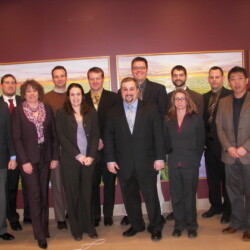 Professors Bruce Clarke (l), Stacy Bonos (front row, 2nd from r), and Josh Honig (back row, 2nd from r) and former graduate students at the 2011 annual Rutgers Turf Symposium. Photo credit: Shaun Barry. Bruce Clarke and former graduate students standing at Turf Symposium