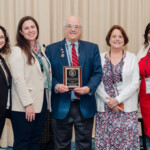 L-R: Amy Mandelbaum, Senior Program Administrator, NJAES; Jacqueline McGlynn, Director of Administration, Office of the Chancellor; David P. Spalding, Raisbeck Endowed Dean and Vice President, Economic Development and Industry Relations, Iowa State University, who made the presentation of the IEP award plaque to Rutgers; Peggy Brennan-Tonetta, Senior Director and Director Resource and Economic Development, NJAES; and Francine Conway, Chancellor, Rutgers-New Brunswick.