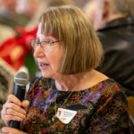 A person speaking into a microphone