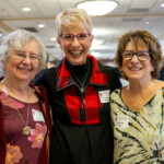 Three people posing for a photo together