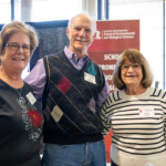 Three people posing for a photo together