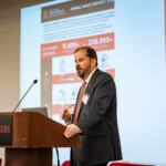 A person speaking at a podium