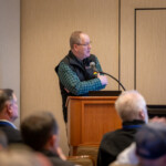 A speaker presenting to a group