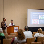 Two speakers present to a group about Farmers Market Training