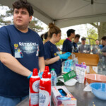 Students serving ice cream to Rutgers Day attendees