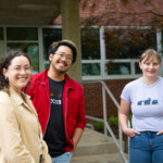 Three people posing for a picture