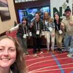 Six people pose for a picture together
