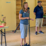 Person talking into a microphone