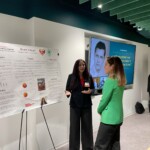 Jennessa Raval presents her project Heart 2 Heart to a passerby