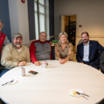 Joyce Carlson takes a joyous photo with five others.