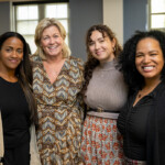 Joyce Carlson takes a joyous photo with three others.