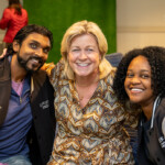 Joyce Carlson takes a joyous photo with two others.