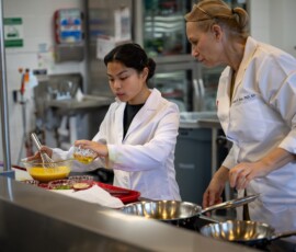 Salome Papaspyrou Rao, assistant teaching professor in the Department of Nutritional Sciences, overseeing the food preparation. Photo: OPOC